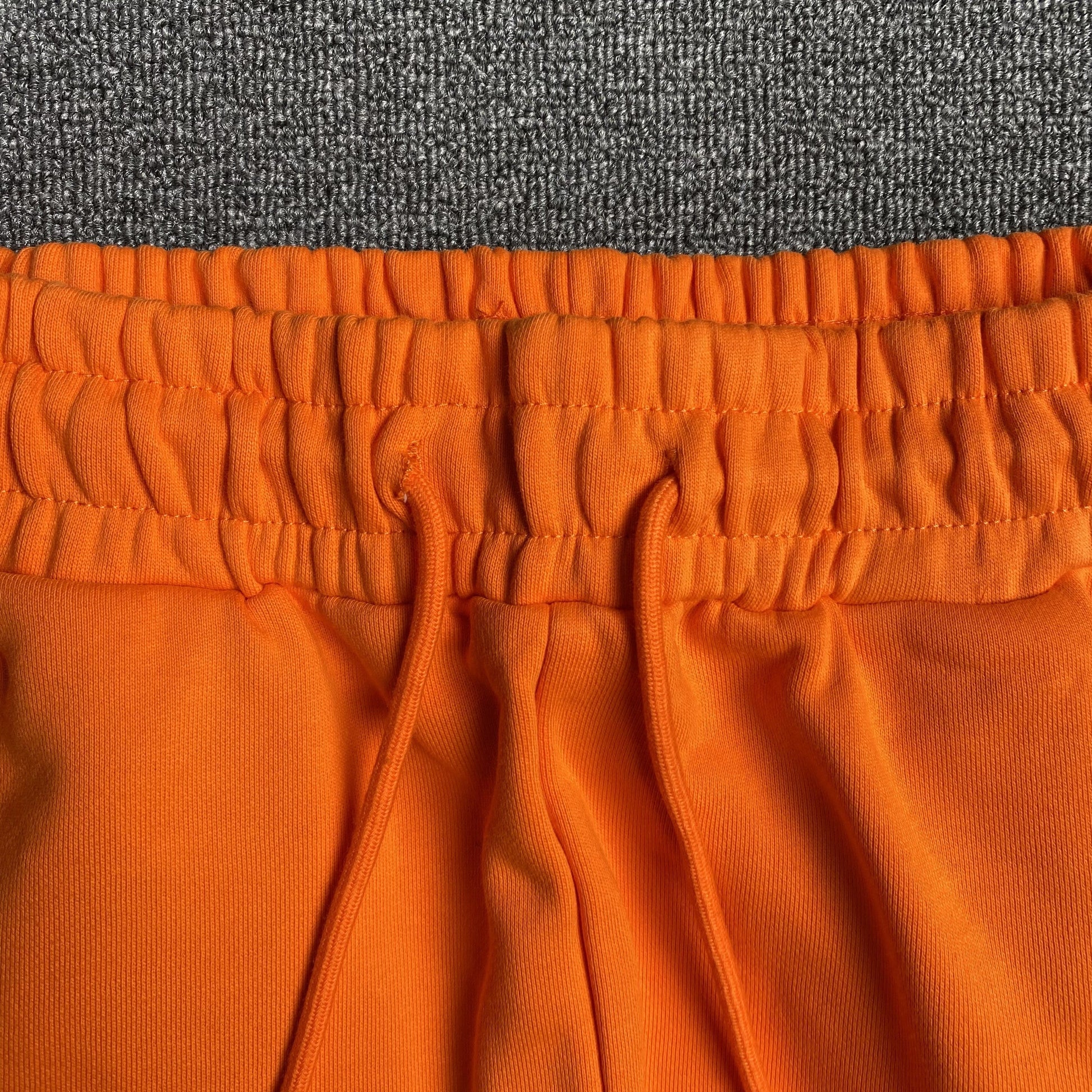 DENIM TEARS COTTON WREATH SWEATPANTS ORANGE - Phantom Kicks