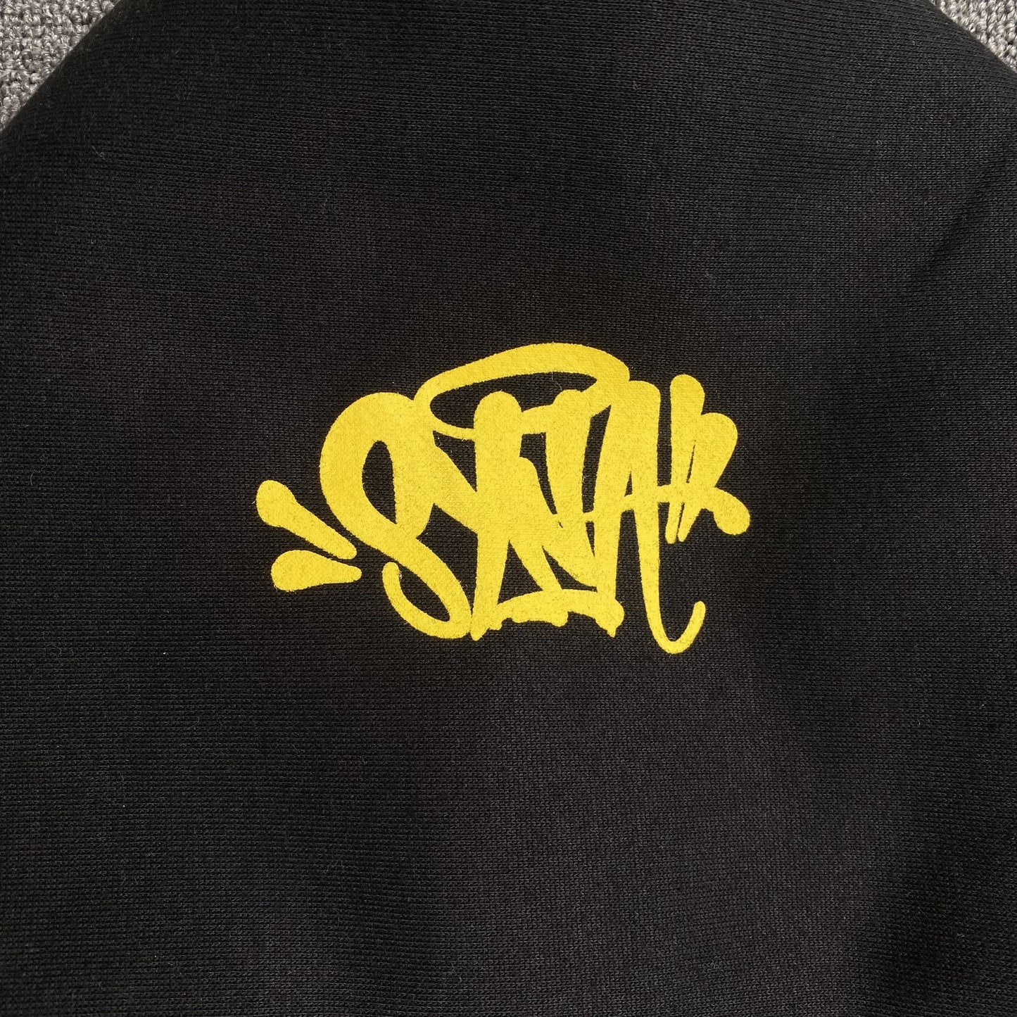 SYNA WORLD COLLEGE HOODIE BLACK - Phantom Kicks