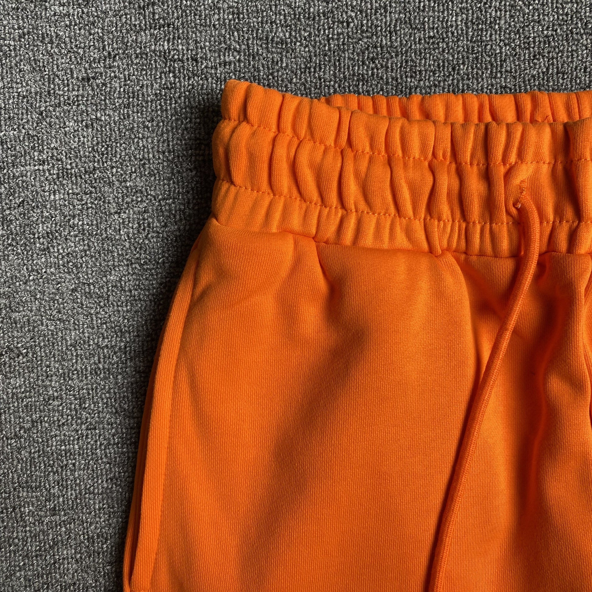 DENIM TEARS COTTON WREATH SWEATPANTS ORANGE - Phantom Kicks