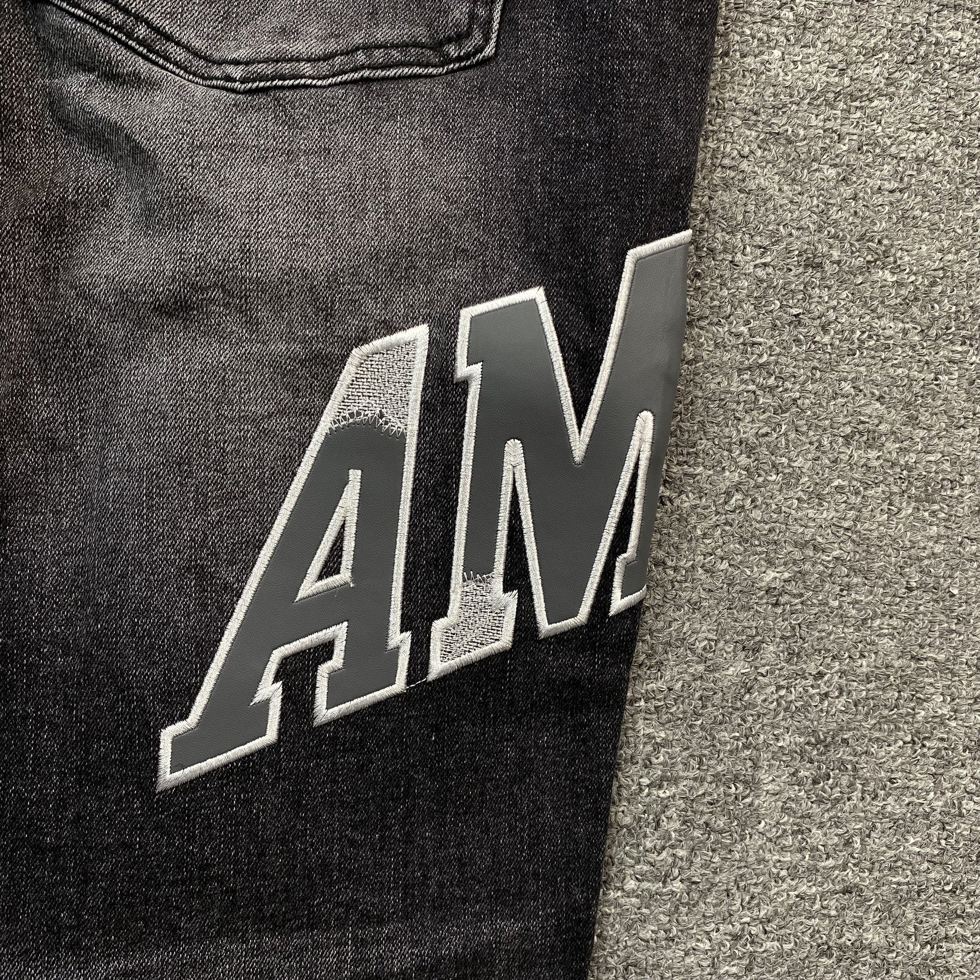 AMIRI VARSITY LOGO REPAIR JEANS - Phantom Kicks
