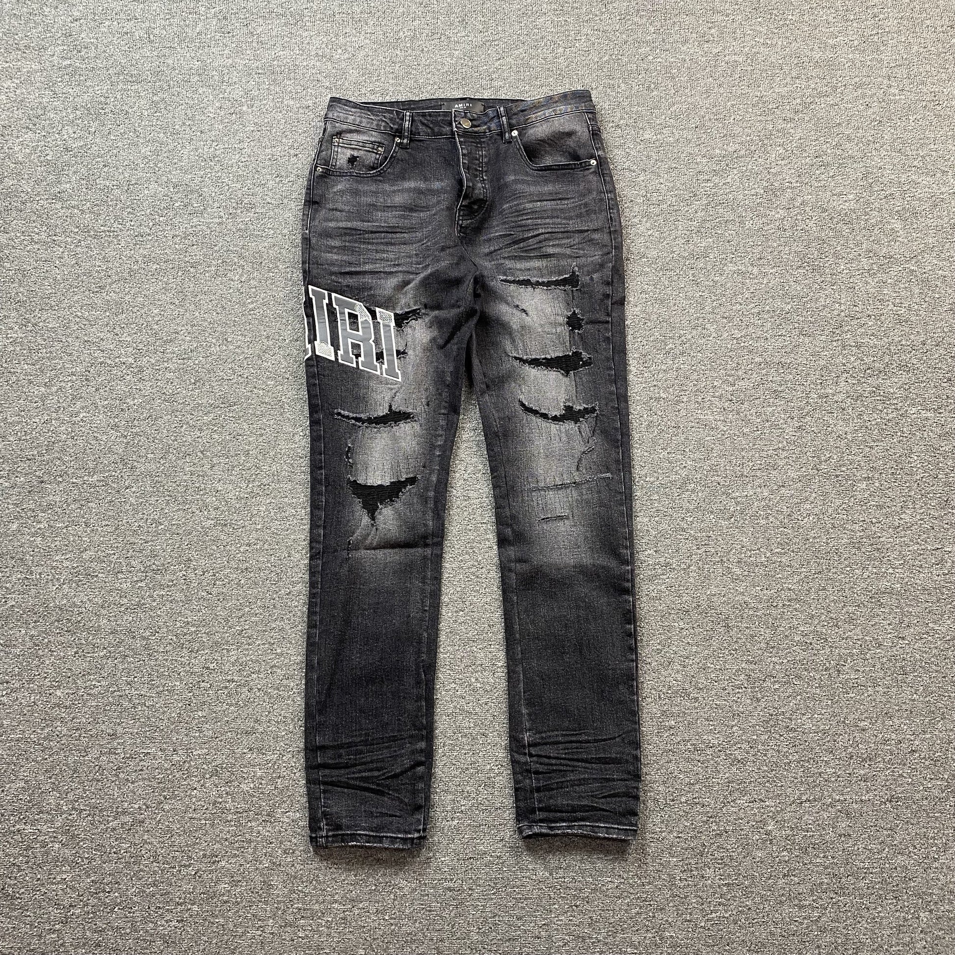 AMIRI VARSITY LOGO REPAIR JEANS - Phantom Kicks