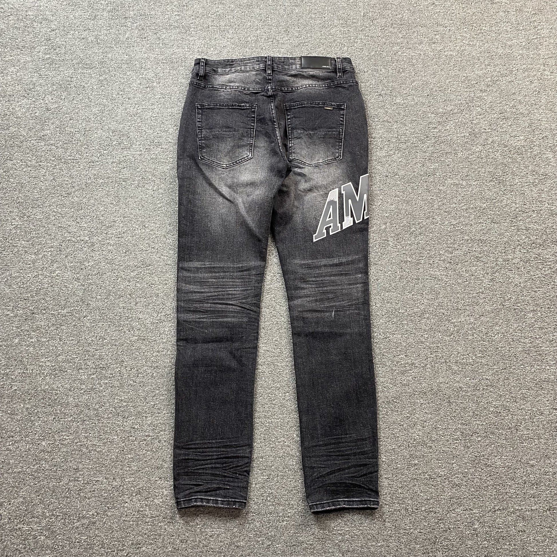 AMIRI VARSITY LOGO REPAIR JEANS - Phantom Kicks