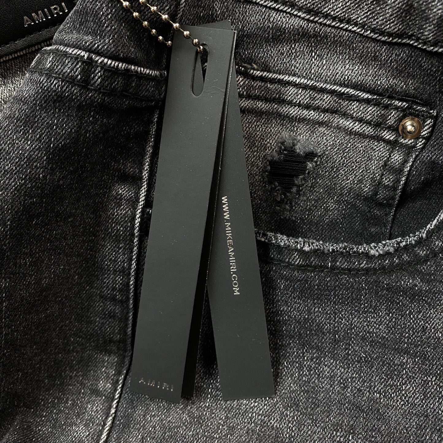 AMIRI VARSITY LOGO REPAIR JEANS - Phantom Kicks