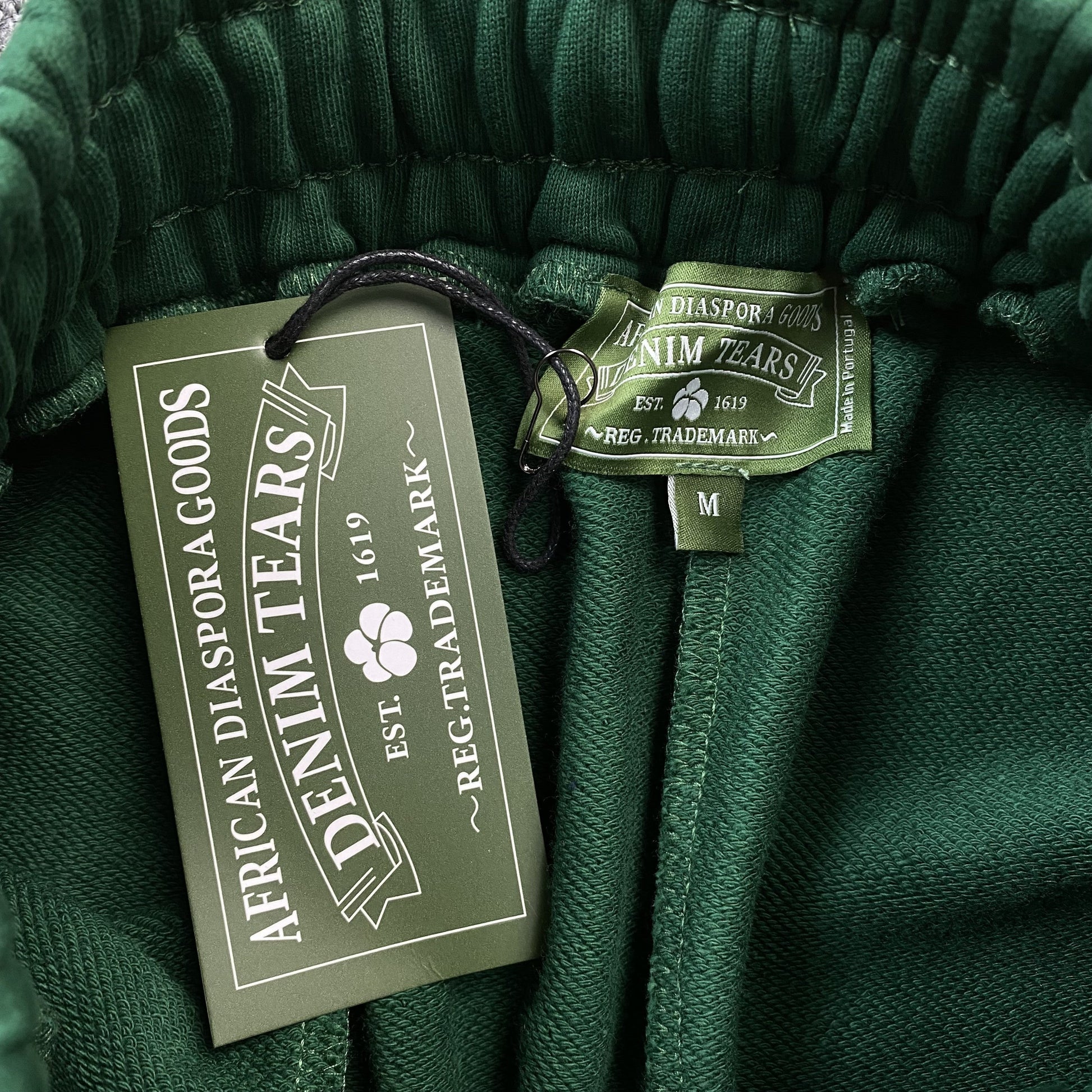 DENIM TEARS COTTON WREATH SWEATPANTS DARK GREEN - Phantom Kicks