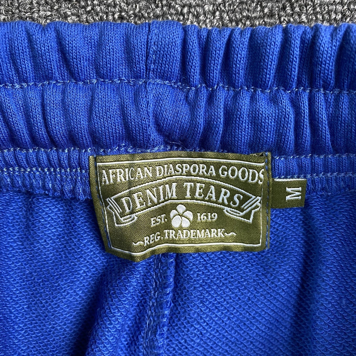 DENIM TEARS COTTON WREATH SWEATPANTS DEEP BLUE - Phantom Kicks