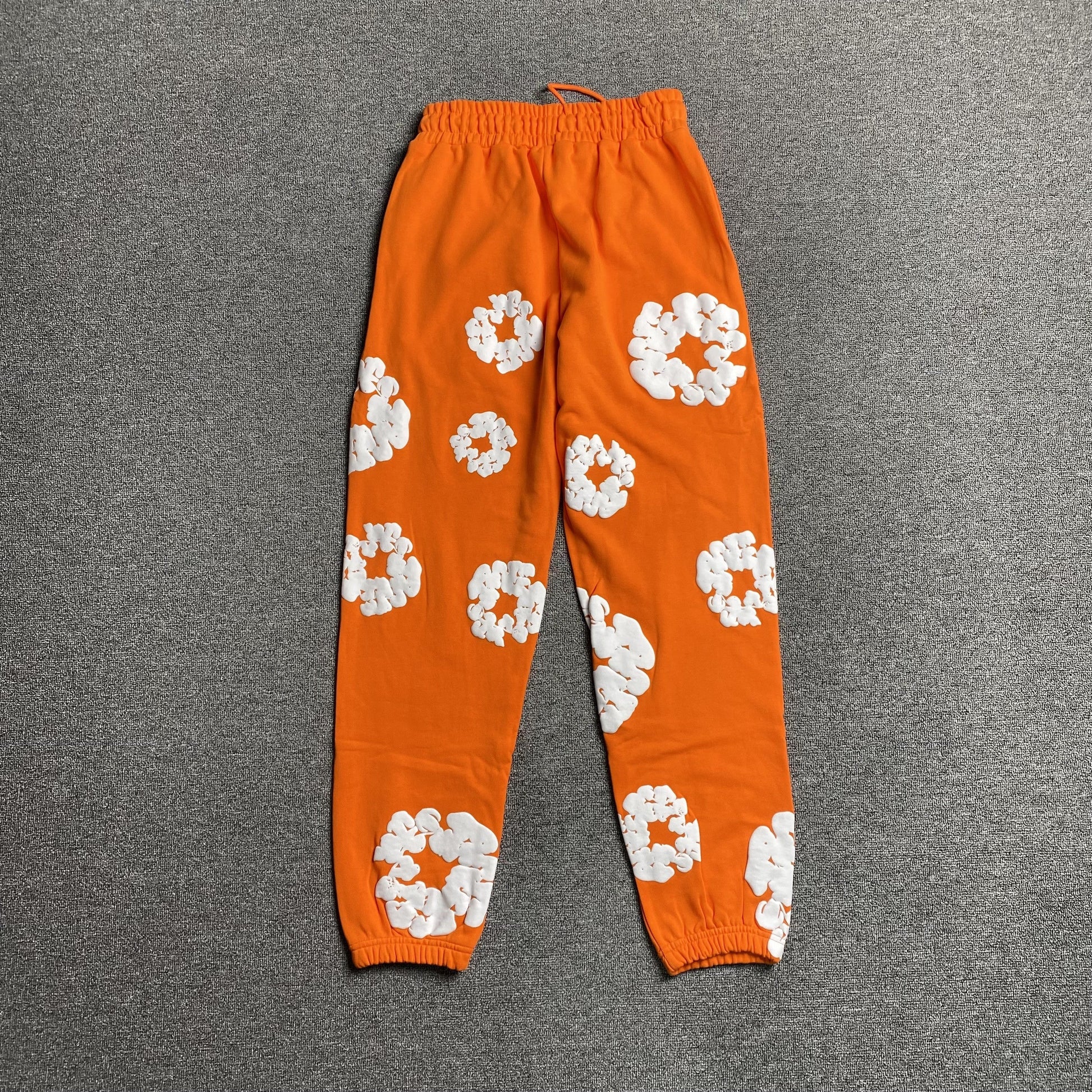DENIM TEARS COTTON WREATH SWEATPANTS ORANGE - Phantom Kicks
